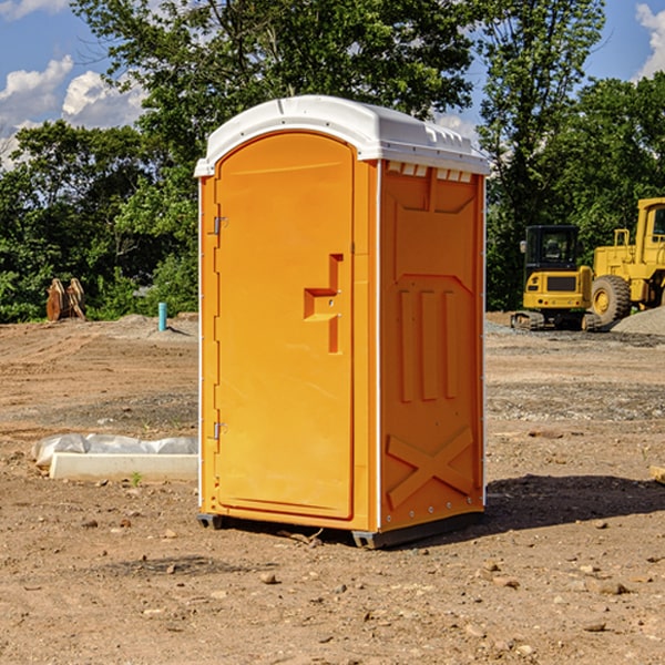 how often are the porta potties cleaned and serviced during a rental period in Charm